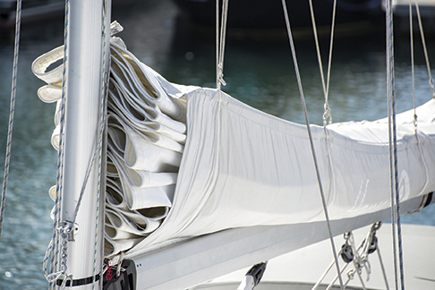 Detail image of mast and sail system on yacht sailboat