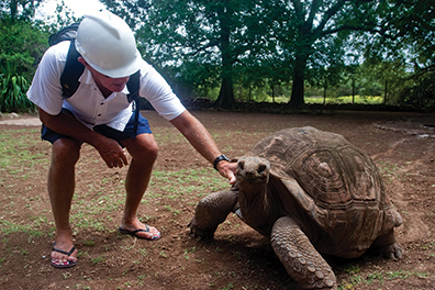 The author's husband Joseph, greeting one of the elder Giant Aldabran tortoises