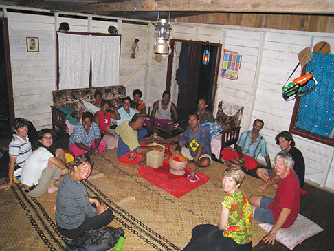 Kava night with Fijian friends and other voyagers, Seth and Ellen far left
