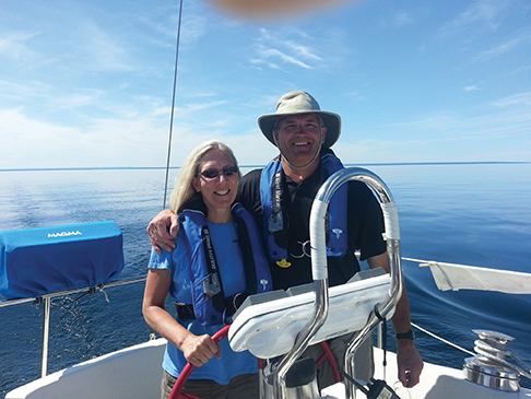 Cindy with her husband Michael at the helm