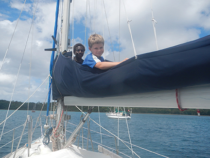 Nicky shows a local boy his favorite hideaway aboard Namani
