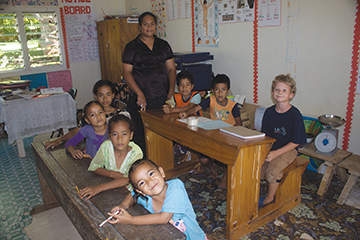 Nicky sits among his classmates at the one room schoolhouse on Lape Island
