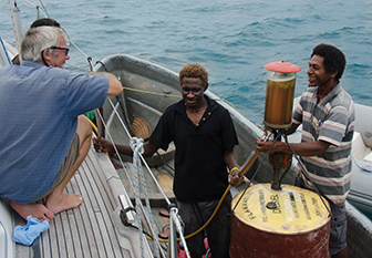 Malcolm did not trust Jim with his pump so brought out the fuel himself to the anchorage in Kavieng