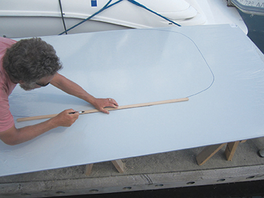 Mike finishing the outline of the hardtop template before cutting the StarBoard