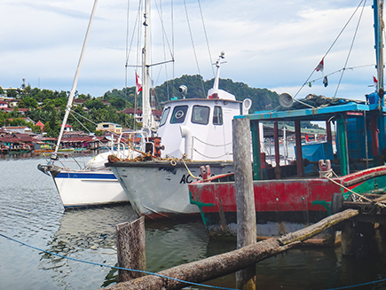 Tenaya tied to the old Coast Guard boat at Bitang Dock 9