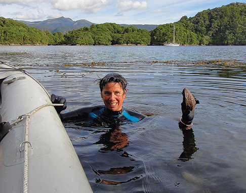 Collecting abalone in Dusky Sound from the kayak