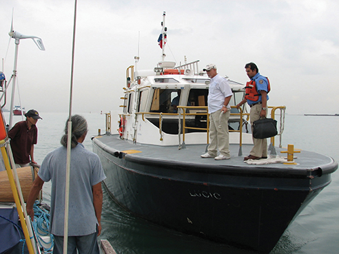 The advisor arrives on the pilot boat