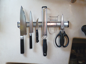 Knives safely stored on a magnetic strip
