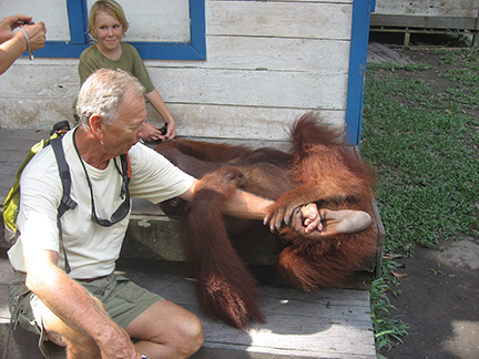 Ron visiting with a friend in Kumai