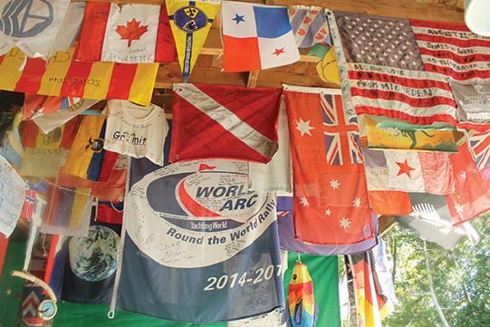 Flags hanging from the ceiling of the famous Suwarrow Yacht Club