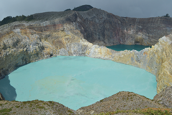 Pale and dark blue lakes, two of the three colored lakes of Kelimutu, Flores